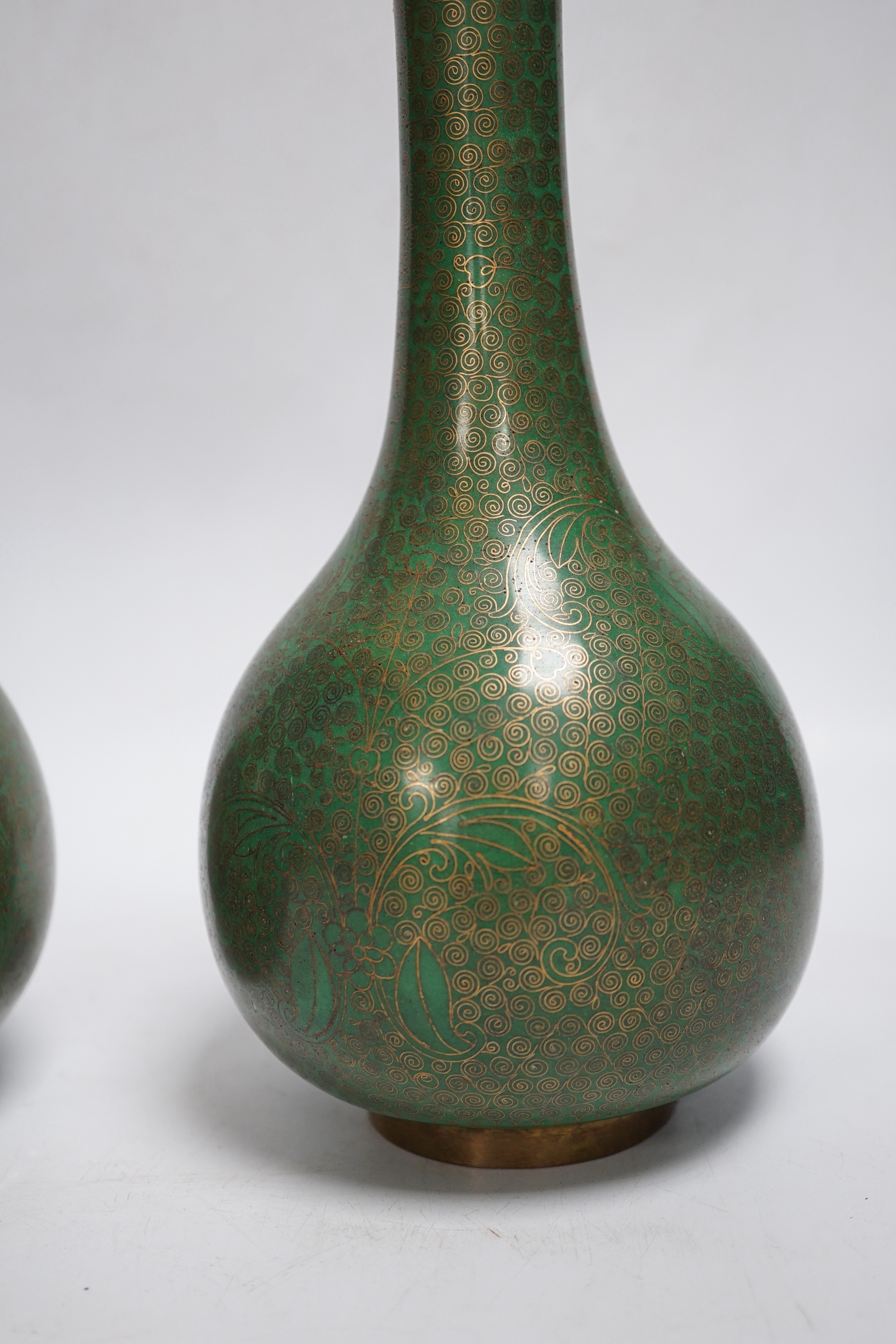 A pair of Chinese cloisonne enamel vases and a box and cover, tallest 23cm